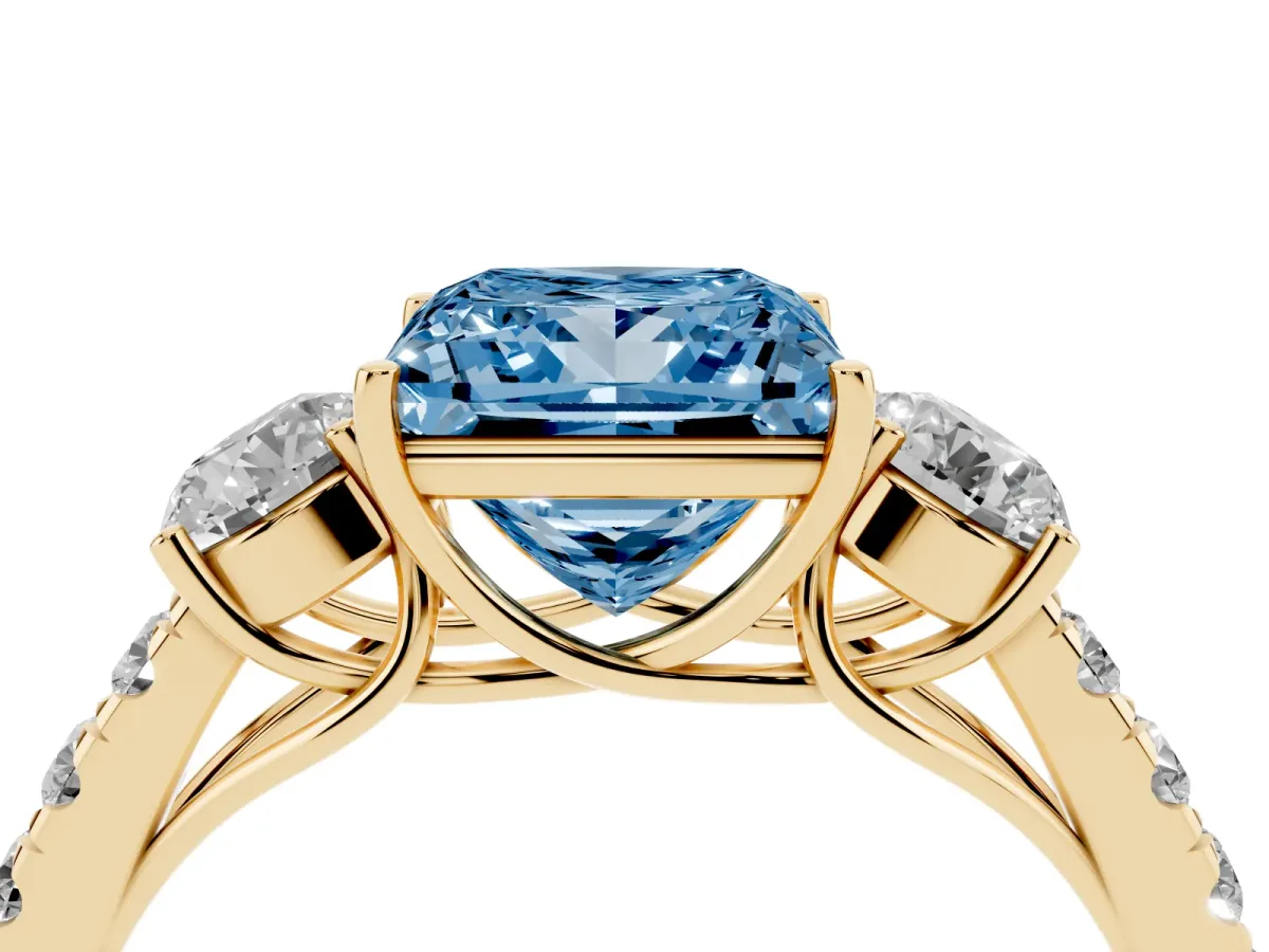 Fancy Blue Princess Cut Cut Diamond Three-Stone Ring with Round Side Stones and Pavé Band Yellow gold