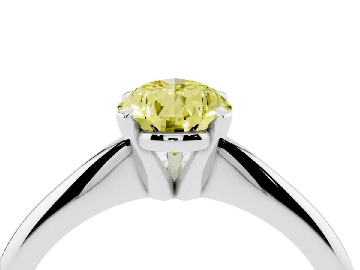Fancy Yellow Pear Cut Cut Solitaire Ring with Four-Prong Setting on a Classic Band Silver