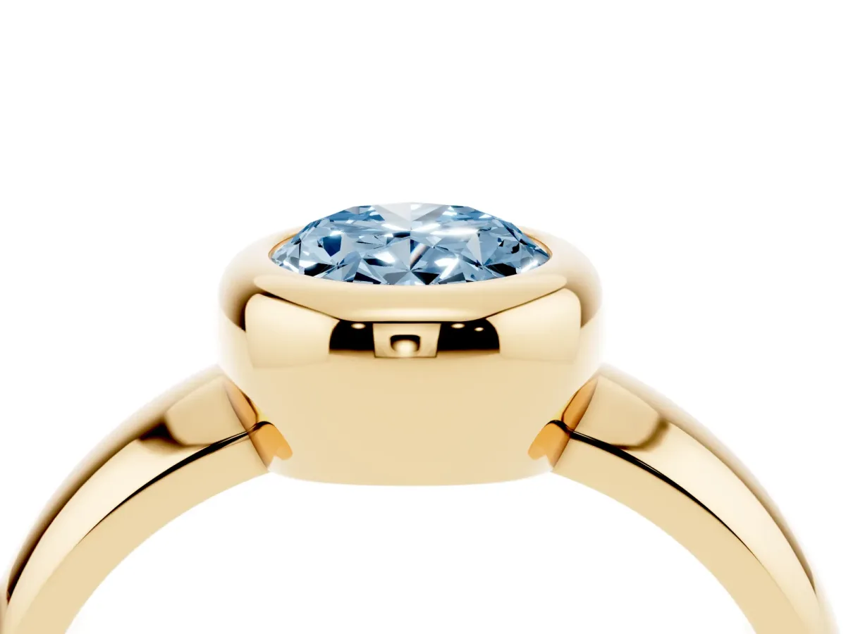 Fancy Blue Bezel Set Oval Cut Solitaire Ring with Wide Band Yellow gold