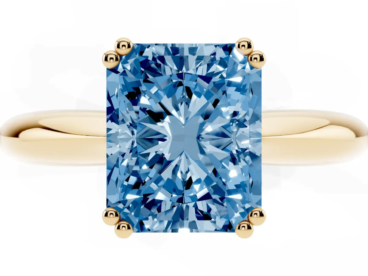 Fancy Blue Radiant Cut Cut Solitaire Engagement Ring with Tapered Band and Four-Prong Setting Yellow gold