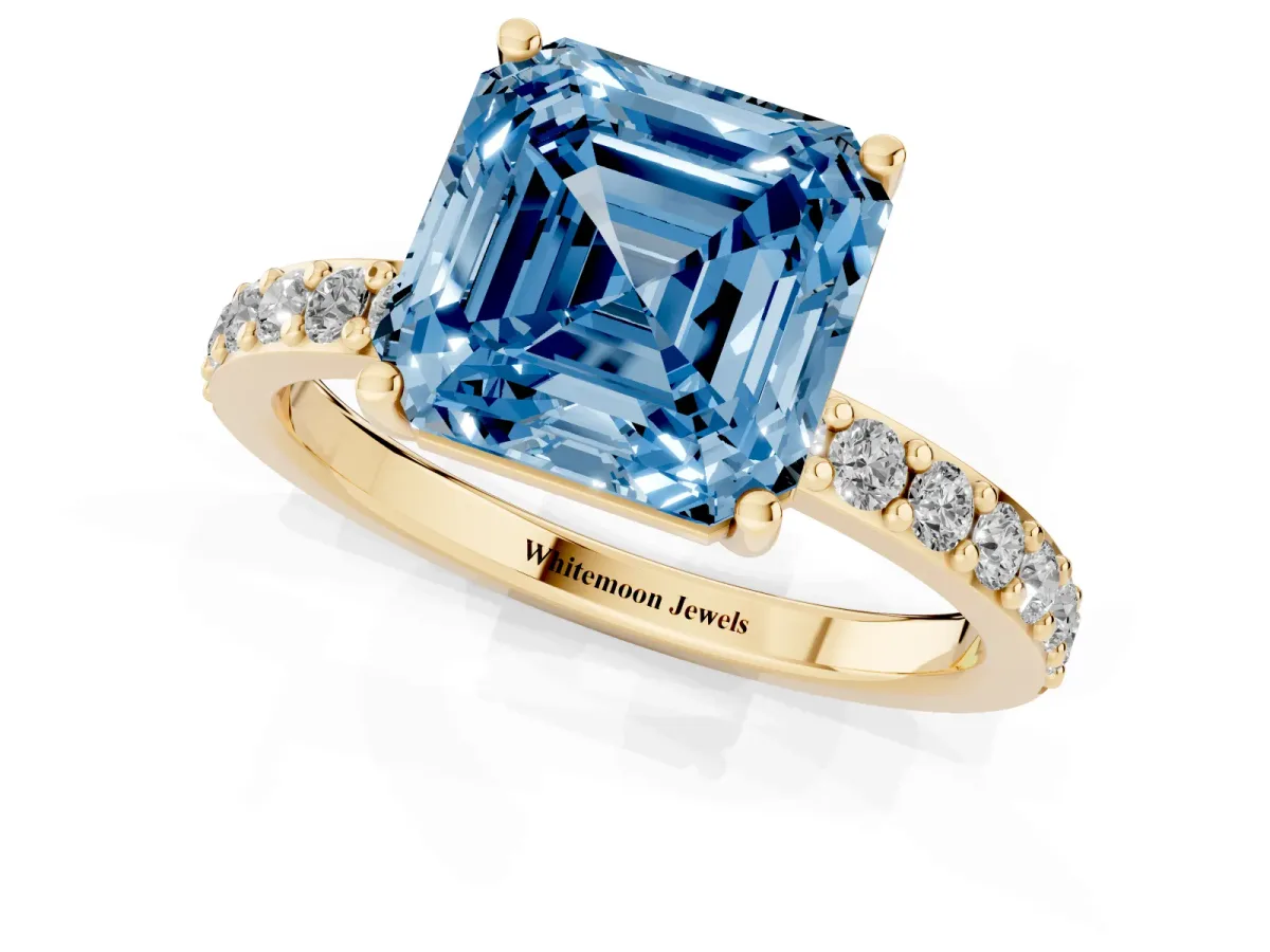 Fancy Blue Asscher Cut Cut Diamond Solitaire with Pave Band and Four-Prong Setting Yellow gold