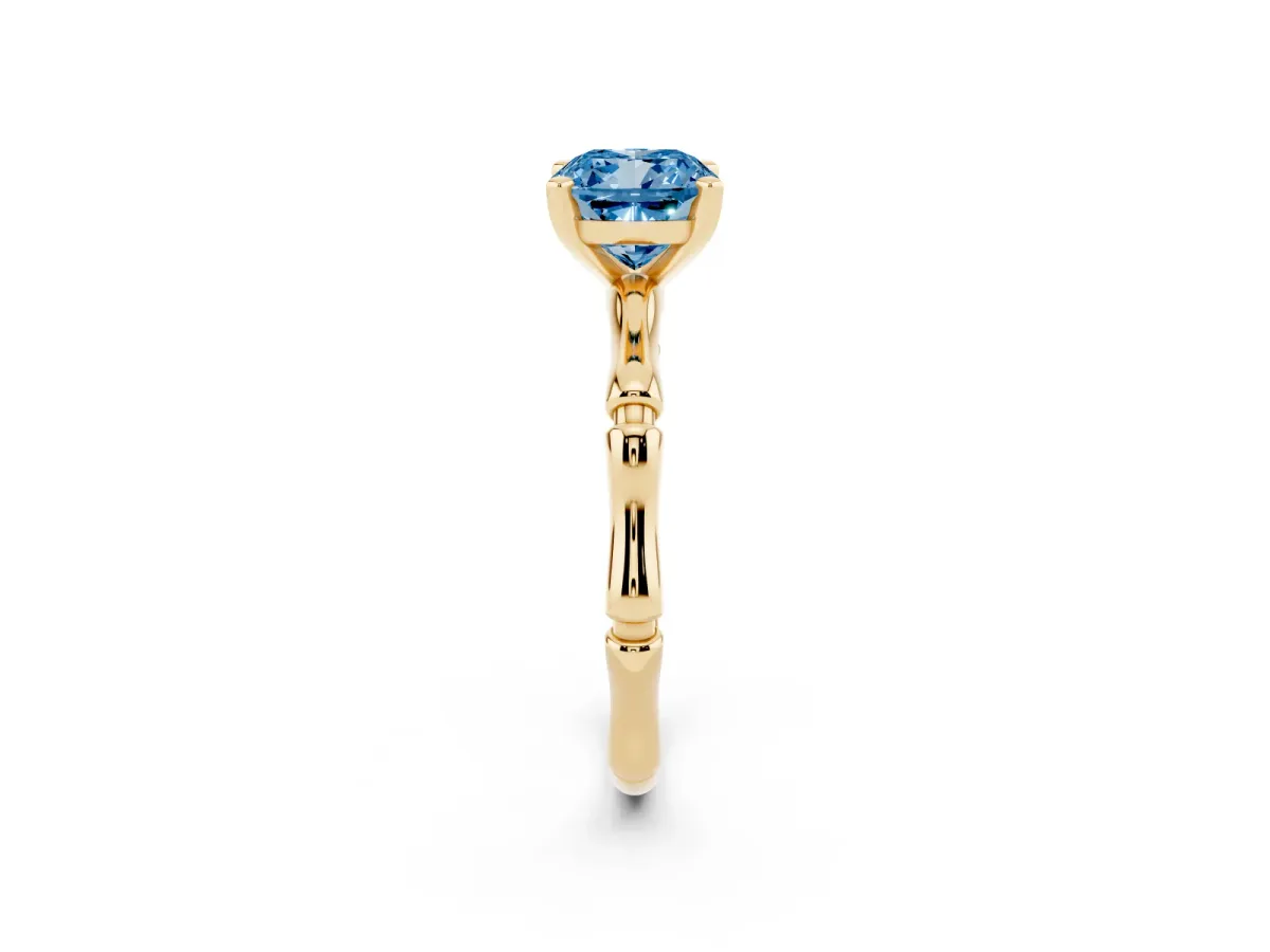 Fancy Blue Cushion Cut Solitaire Diamond Ring with Bamboo Band and Four-Prong Setting Yellow gold