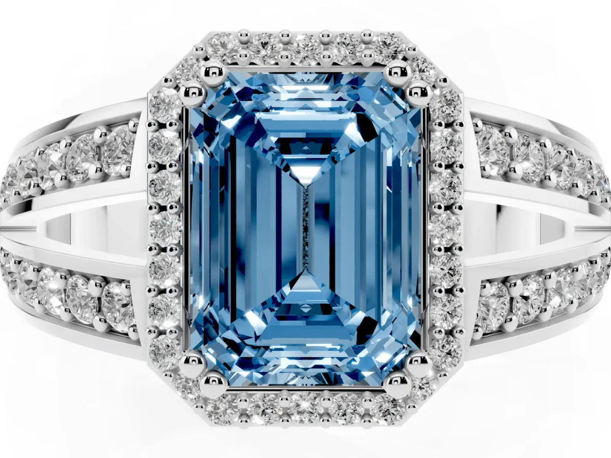 Fancy Blue Emerald Cut Diamond Halo Ring with Split Shank Pavé Band and Four-Prong Setting White gold