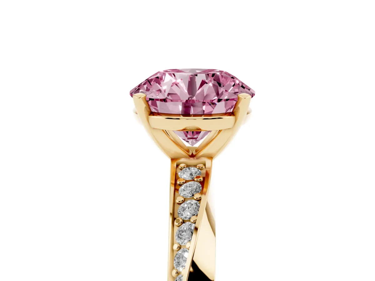 Fancy Pink Round Cut Diamond Engagement Ring with Side Stone Accents and Four-Prong Setting Yellow gold