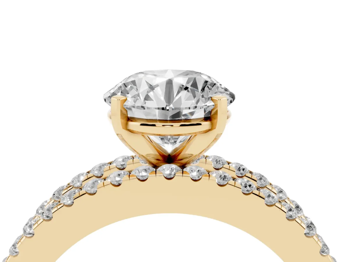 Round Cut Diamond Solitaire Ring with Pavé and Channel Set Band Yellow gold