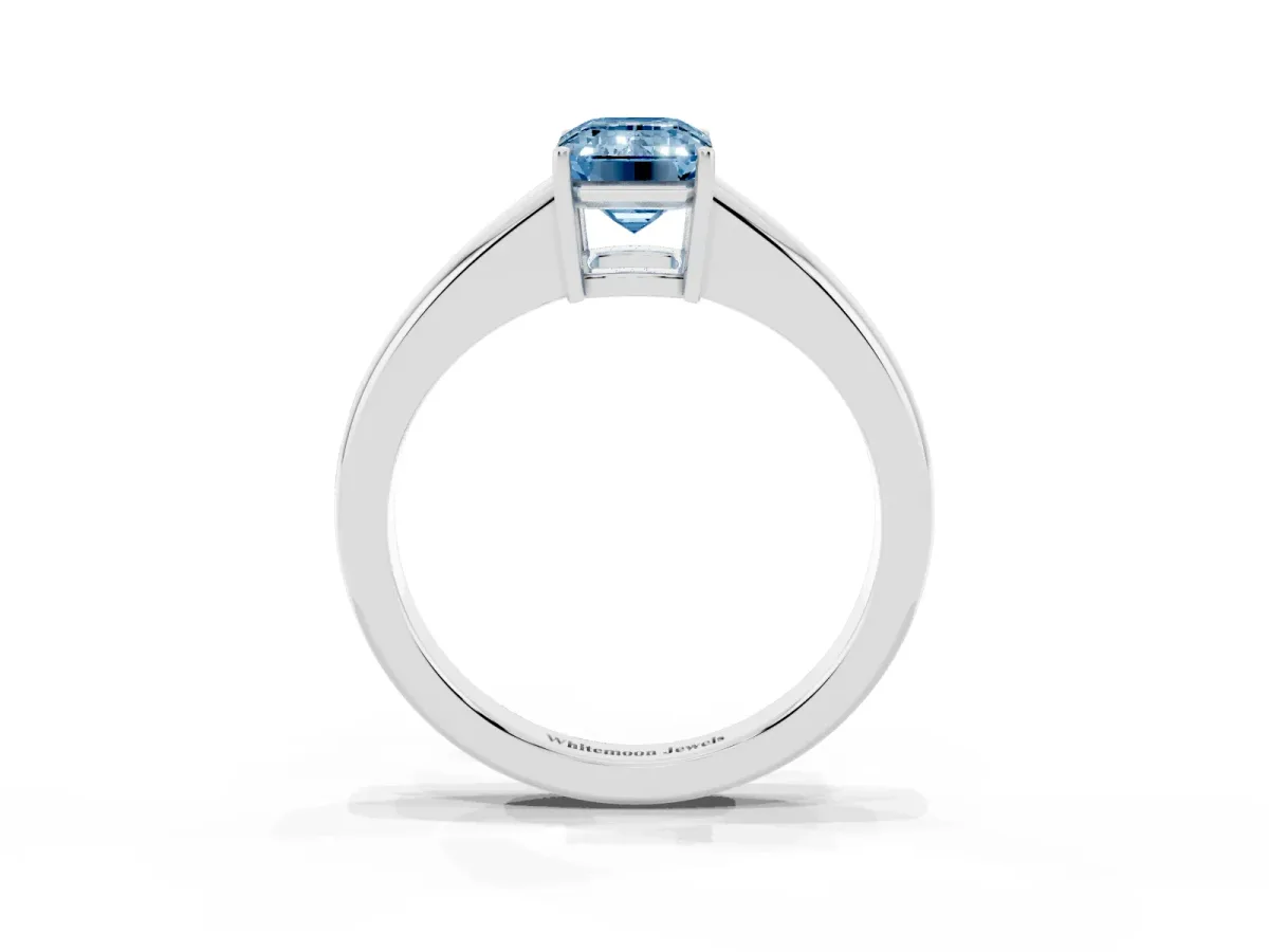 Fancy Blue Emerald Cut Solitaire Diamond Ring with Tapered Band and Four-Prong Setting Platinum