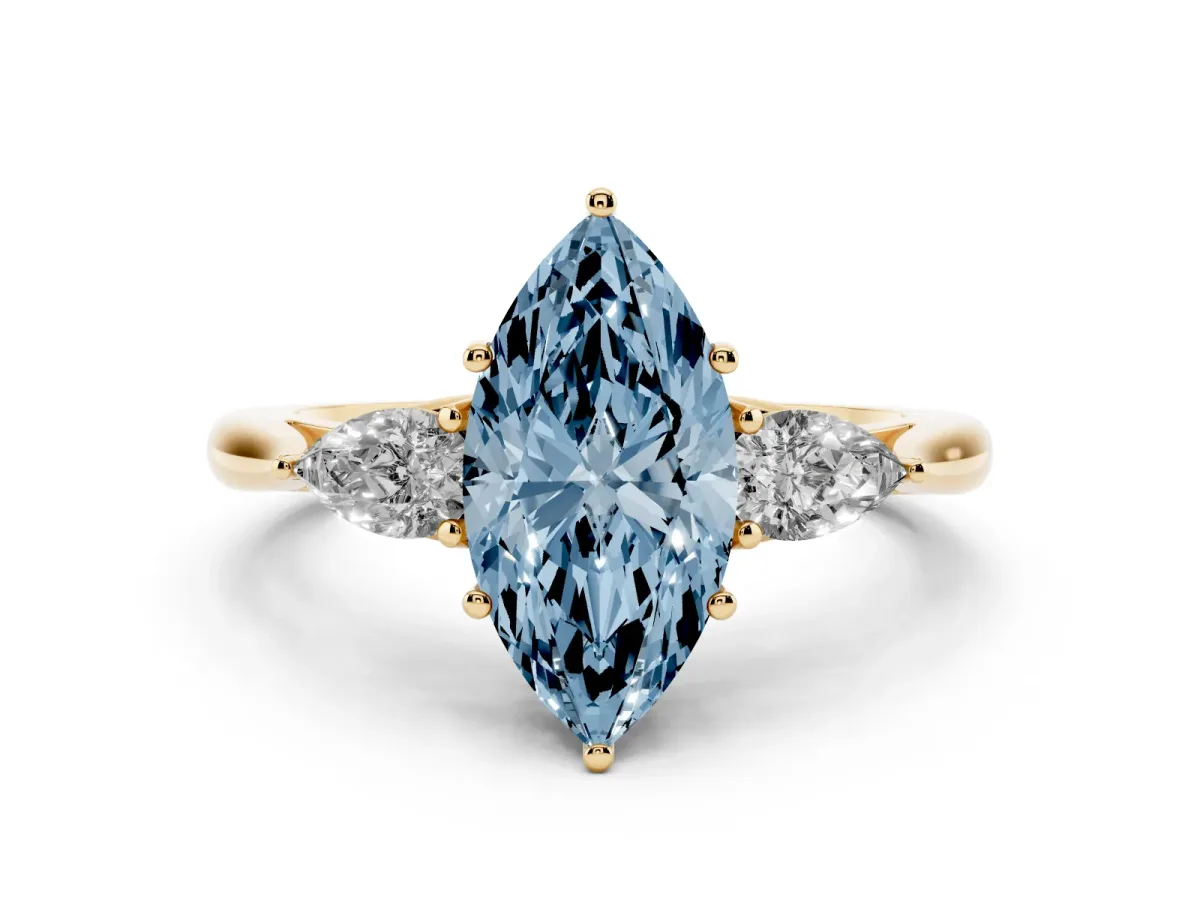 Fancy Blue Three-Stone Marquise Cut Brilliant Diamond Solitaire Ring with Tapered Band and Four-Prong Setting Yellow gold