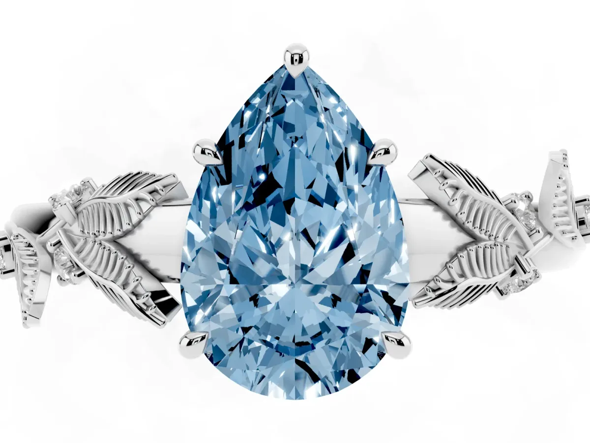 Fancy Blue Pear Cut Diamond Solitaire Ring with Leaf Motif Band and Four-Prong Setting Silver