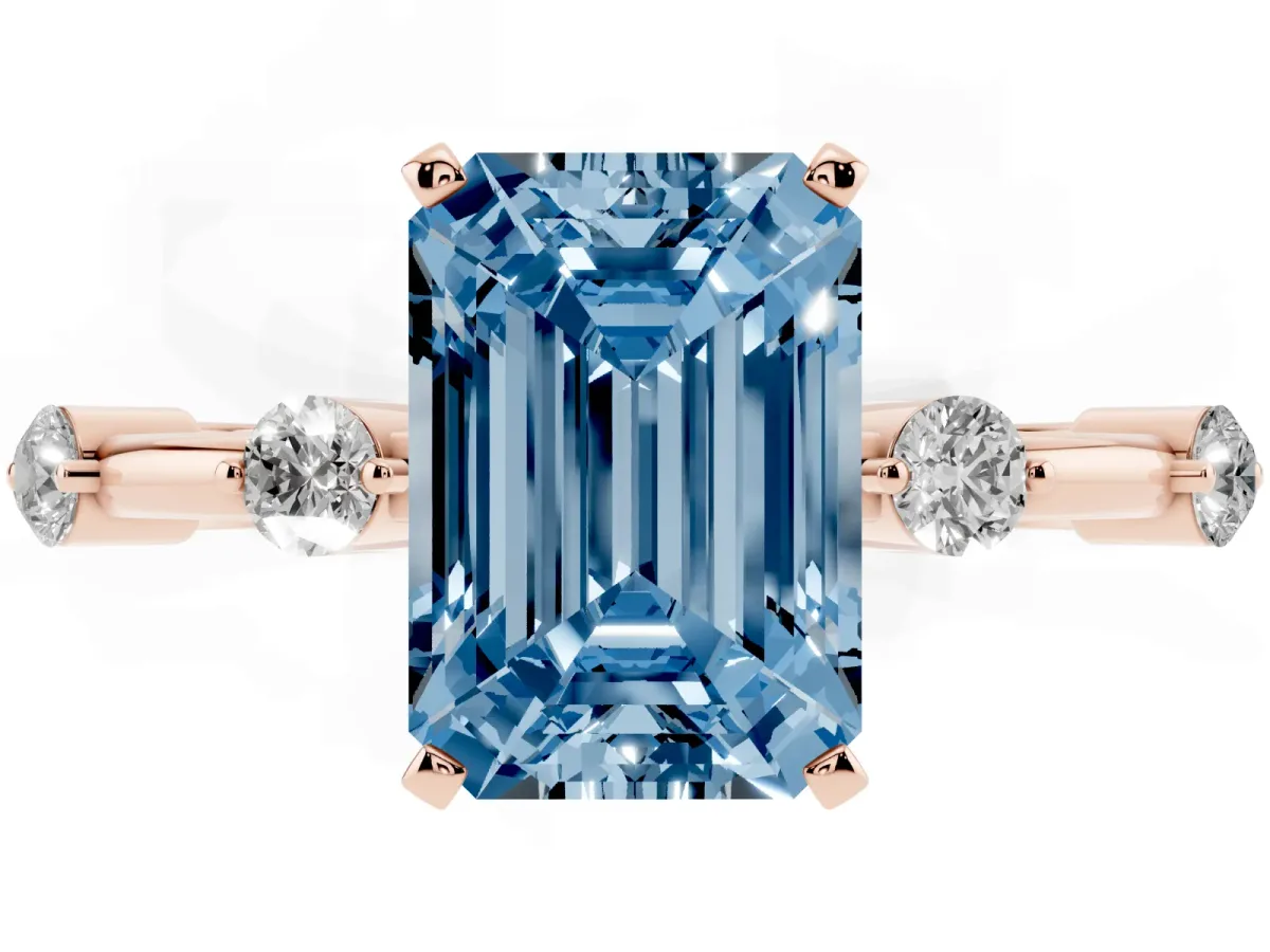Fancy Blue Emerald Cut Solitaire Diamond Ring with Bezel Set Side Stones and Prong Setting Rose gold