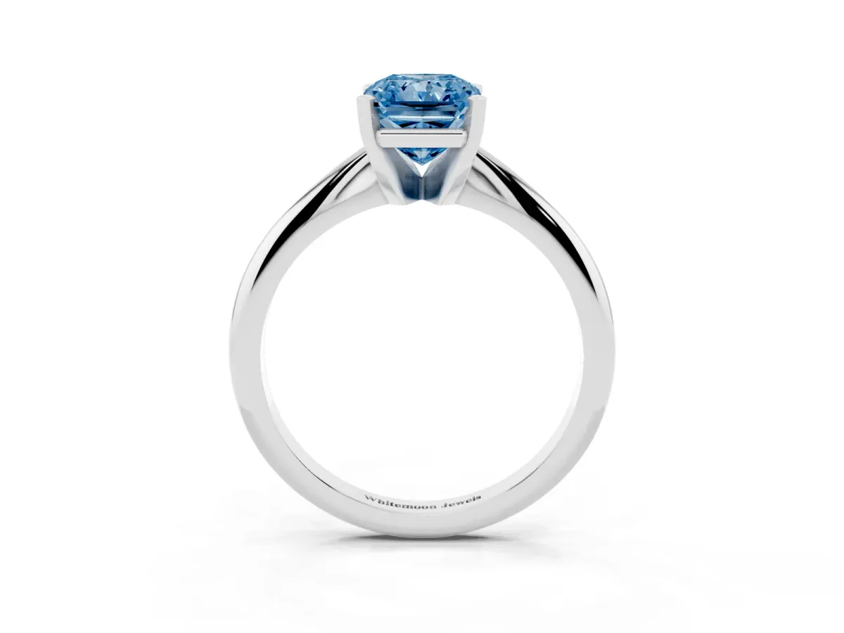 Fancy Blue Radiant Cut Cut Solitaire Ring with Four-Prong Setting on a Classic Band Silver