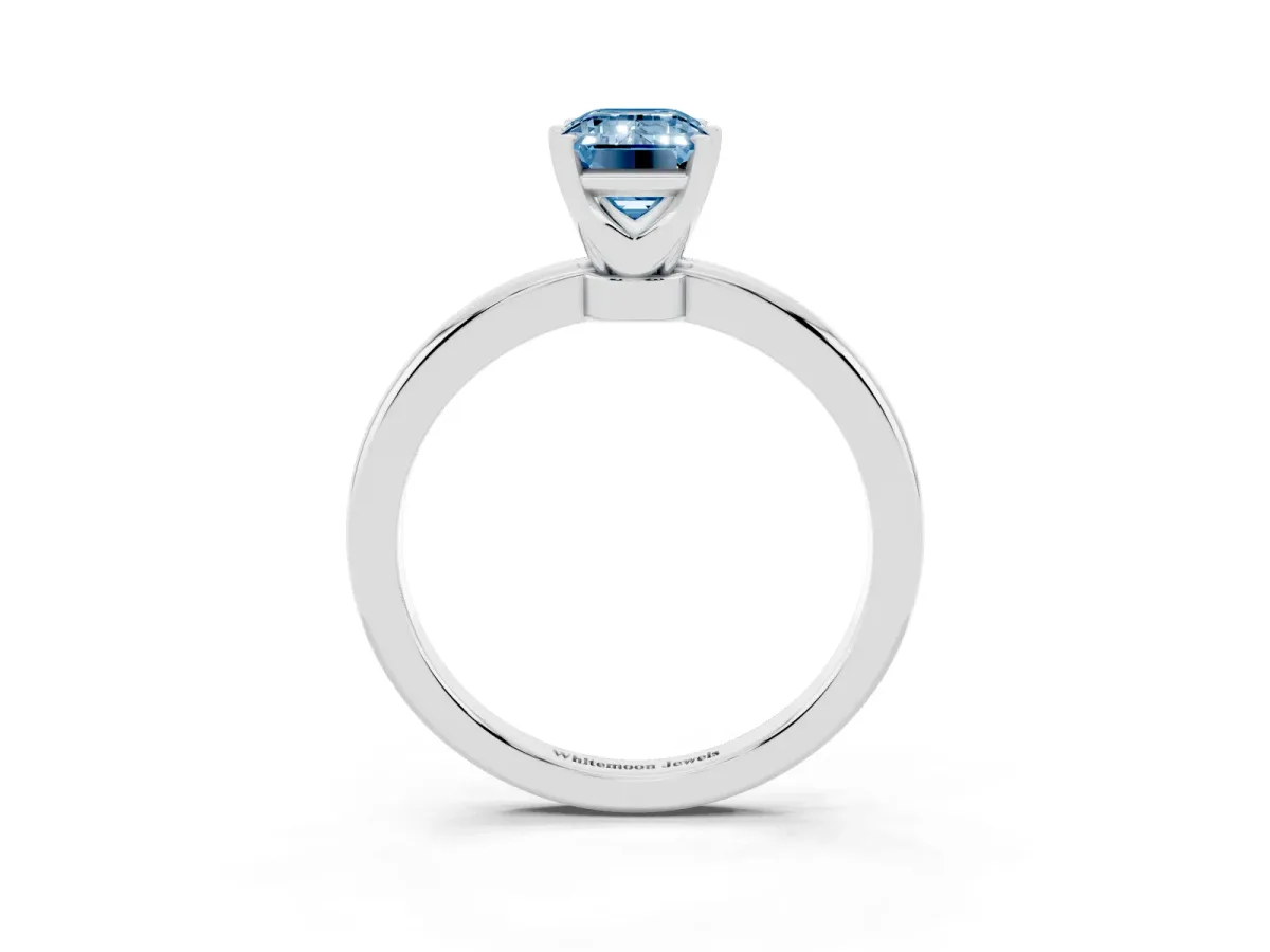 Fancy Blue Emerald Cut Solitaire Diamond Ring with Six-Prong Setting on a Classic Band Platinum