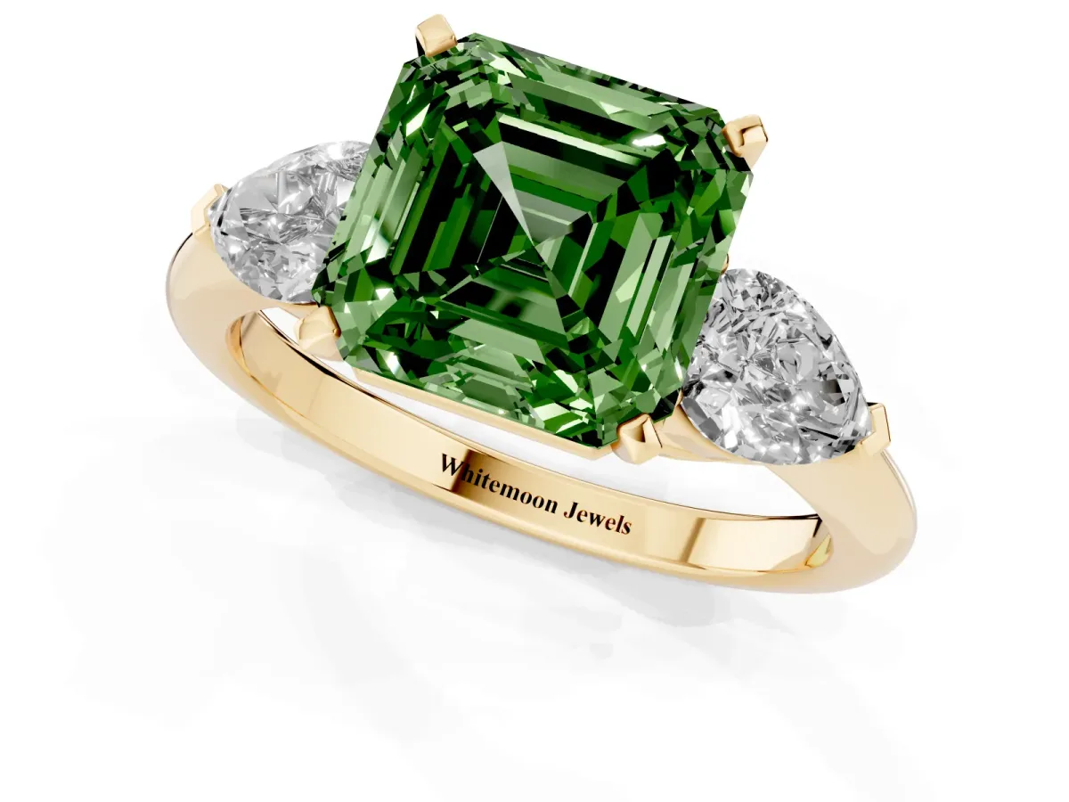 Fancy Green Three-Stone Asscher Cut Diamond Ring with Pear Side Stones and Four-Prong Setting Yellow gold