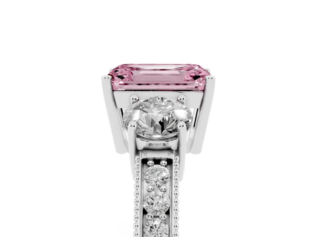 Fancy Pink Emerald Cut Three-Stone Diamond Ring with Pavé Band and Four-Prong Setting Platinum