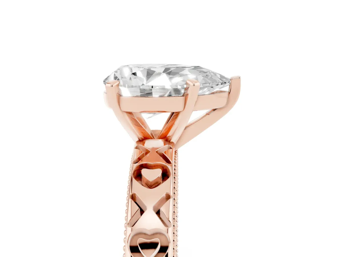 Pear Cut Solitaire Diamond Engagement Ring with XO Engraved Band and Four-Prong Setting Rose gold