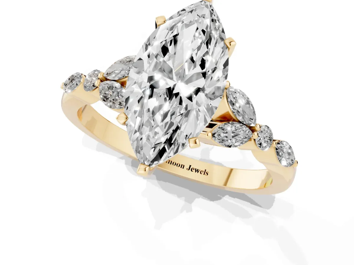 Marquise Cut Diamond Solitaire Ring with Side Stones and Four-Prong Setting Yellow gold