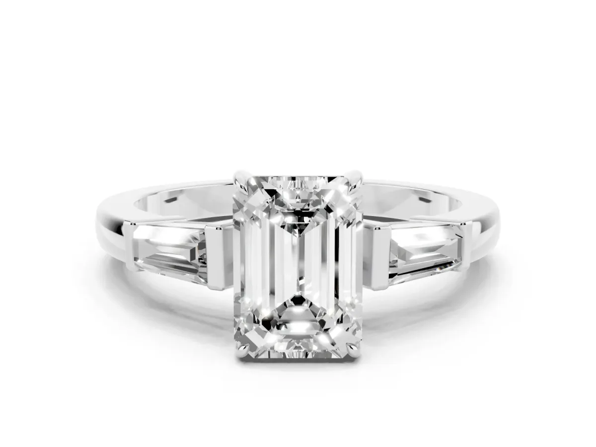 Emerald Cut Diamond Three-Stone Ring with Tapered Baguette Side Stones and Prong Setting White gold