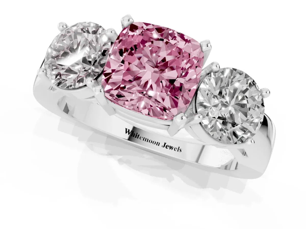 Fancy Pink Three-Stone Cushion Cut Diamond Ring with Round Side Stones, Classic Band, and Four-Prong Setting White gold