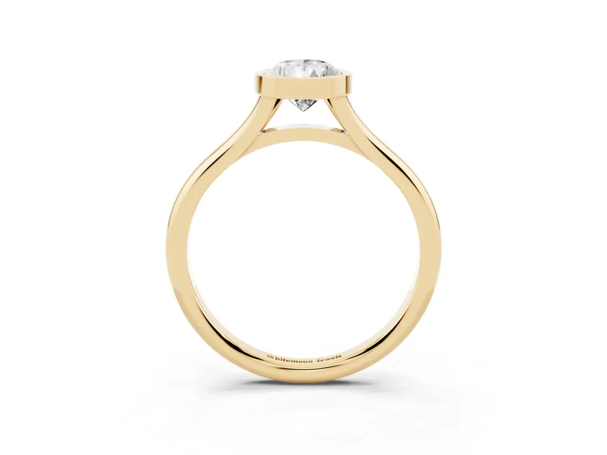 Bezel Set Pear Cut Cut Solitaire Ring with Tapered Band Yellow gold
