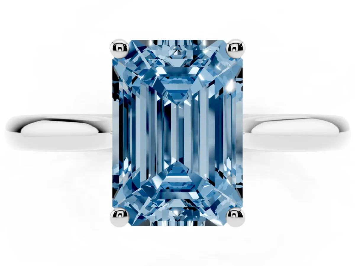 Fancy Blue Emerald Cut Cut Solitaire Ring with Cathedral Band and Four-Prong Setting Silver