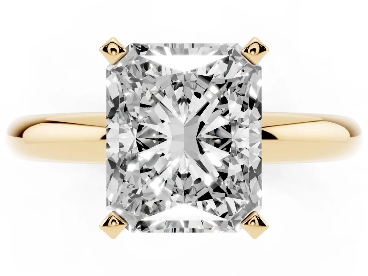 Radiant Cut Diamond Solitaire Engagement Ring with Round Band and Four-Prong Setting Yellow gold