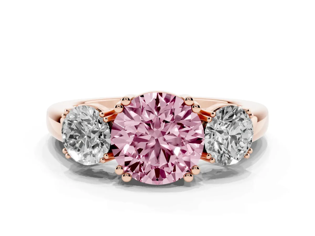 Fancy Pink Three-Stone Round Cut Cut Diamond Ring with Channel Set Band and Four-Prong Setting Rose gold