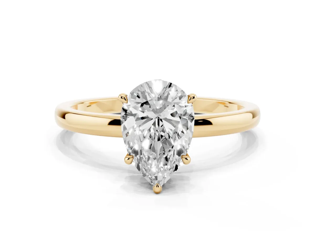 Pear Cut Solitaire Engagement Ring with Cathedral Band and Four-Prong Setting Yellow gold