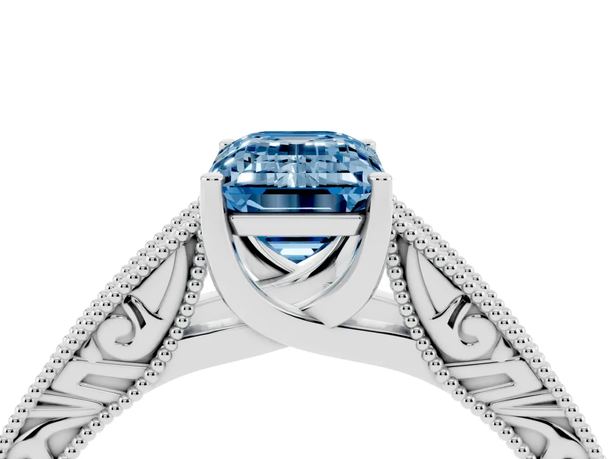 Fancy Blue Emerald Cut Diamond Solitaire Ring with Engraved Band and Four-Prong Setting Platinum