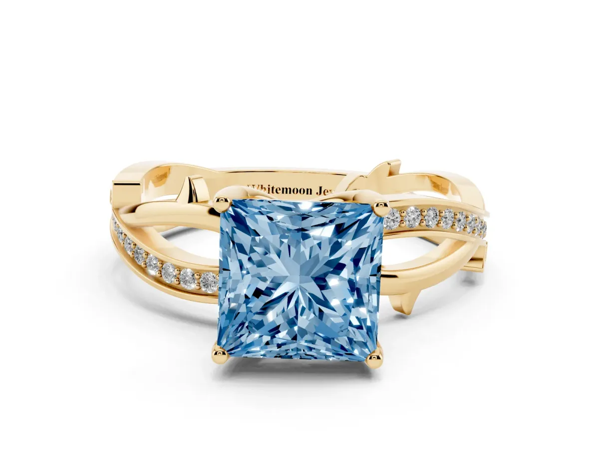 Fancy Blue Princess Cut Solitaire Twist Band with Pavé Accents and Four-Prong Setting Yellow gold