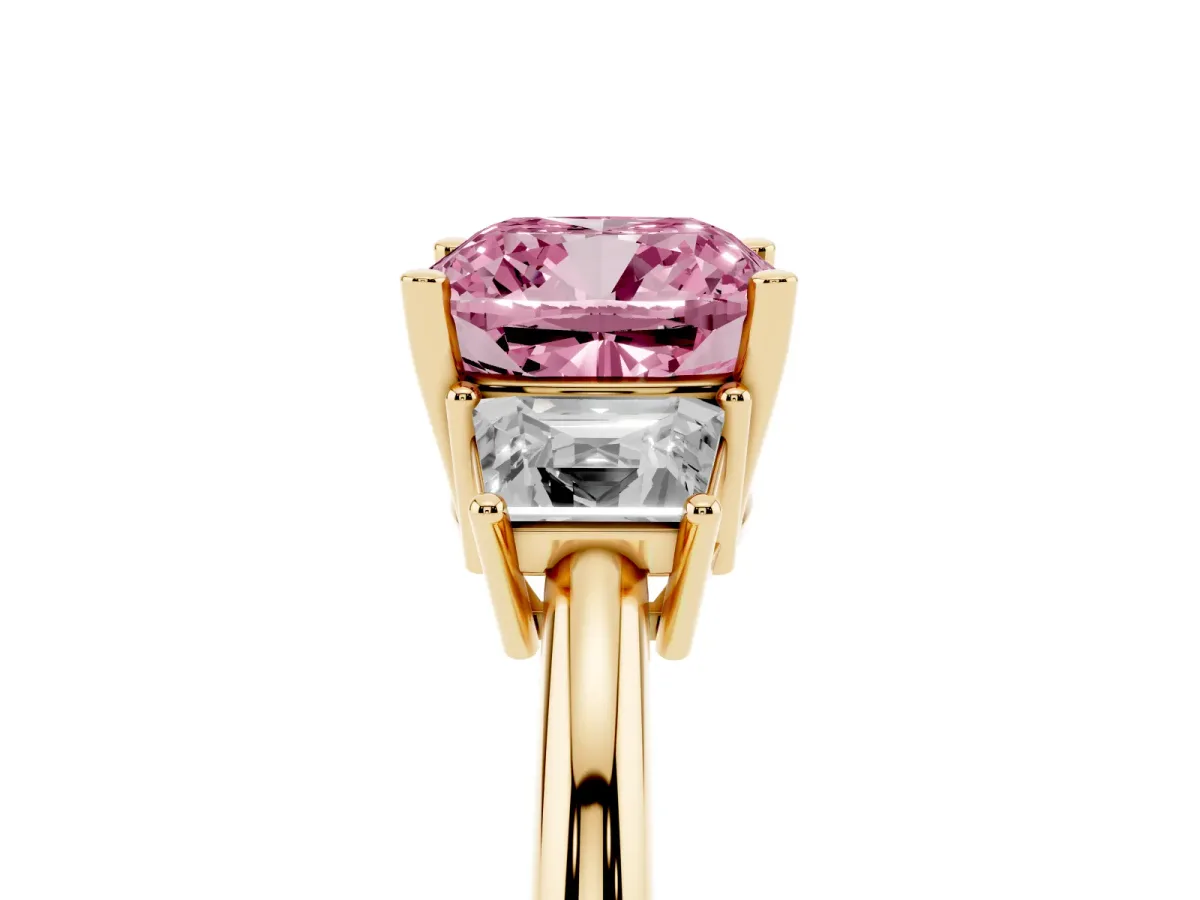 Fancy Pink Cushion Cut Diamond Three-Stone Ring with Trapezoid Side Stones and Prong Setting Yellow gold