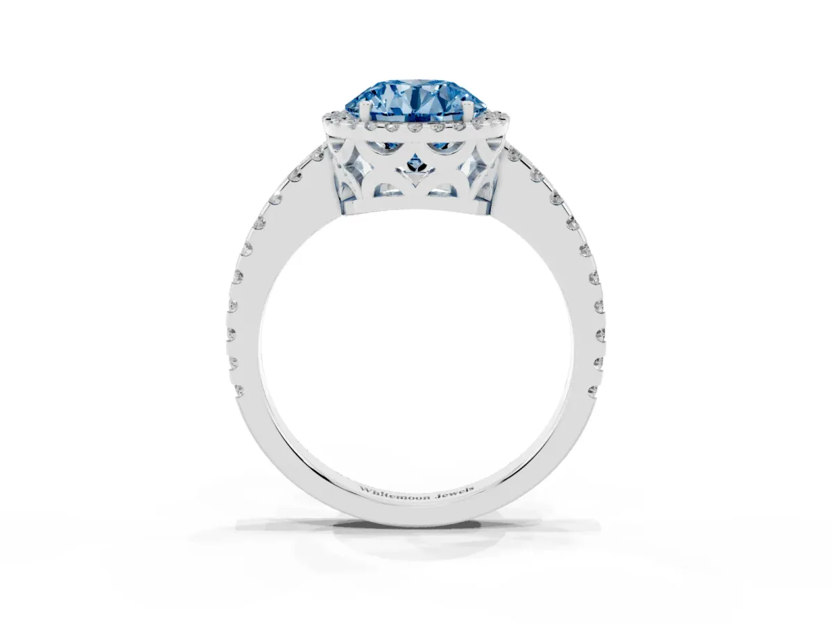 Fancy Blue Round Cut Diamond Halo Engagement Ring with Pavé Band and Prong Setting Platinum