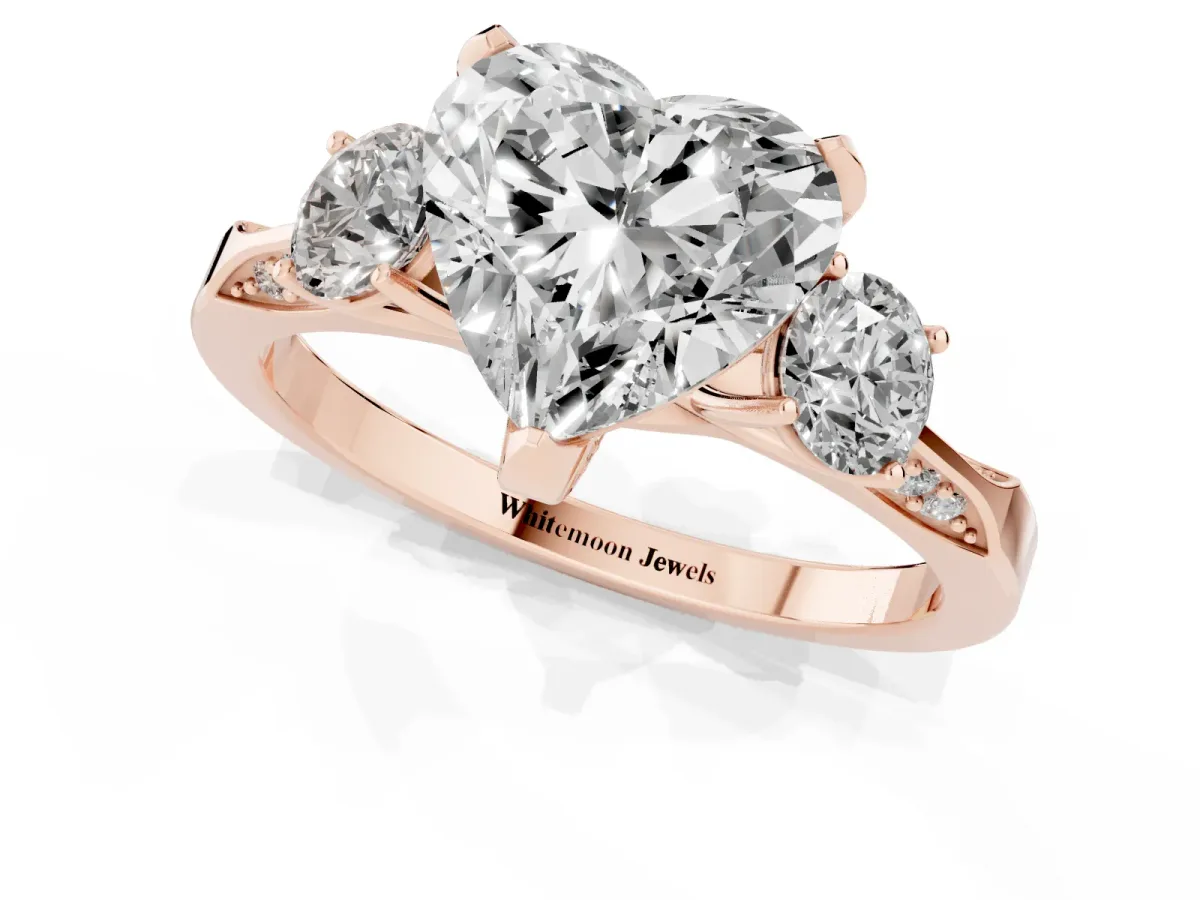 Heart Cut Brilliant Three-Stone Diamond Ring with Pavé Band and Four-Prong Setting Rose gold