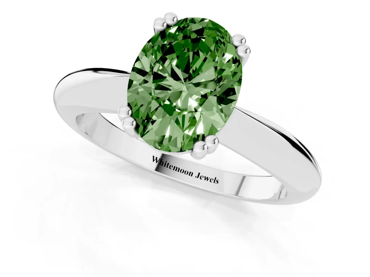 Fancy Green Oval Cut Cut Solitaire Engagement Ring with Tapered Band and Four-Prong Setting Silver