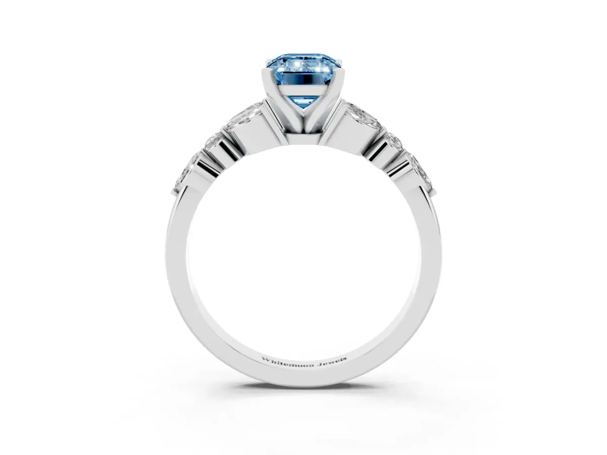 Fancy Blue Emerald Cut Diamond Solitaire Ring with Side Stones and Four-Prong Setting Platinum