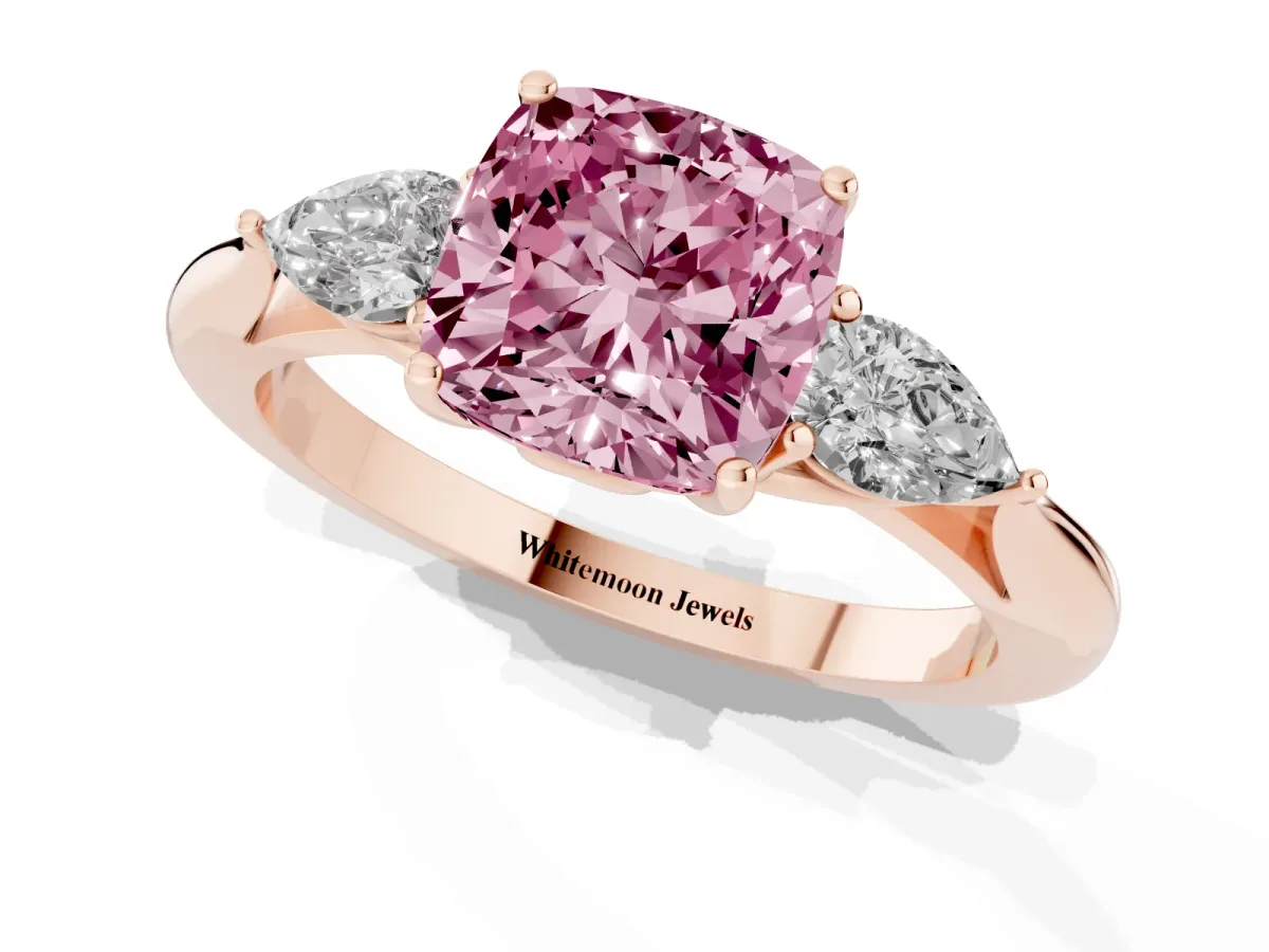 Fancy Pink Three-Stone Cushion Cut Diamond Ring with Pear Side Stones in Four-Prong Setting Rose gold
