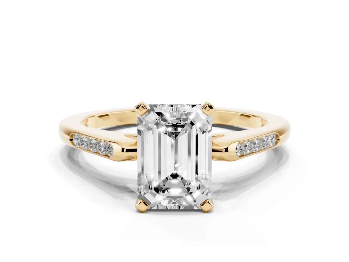 Emerald Cut Diamond Solitaire Ring with Channel Set Round Band and Prong Setting Yellow gold
