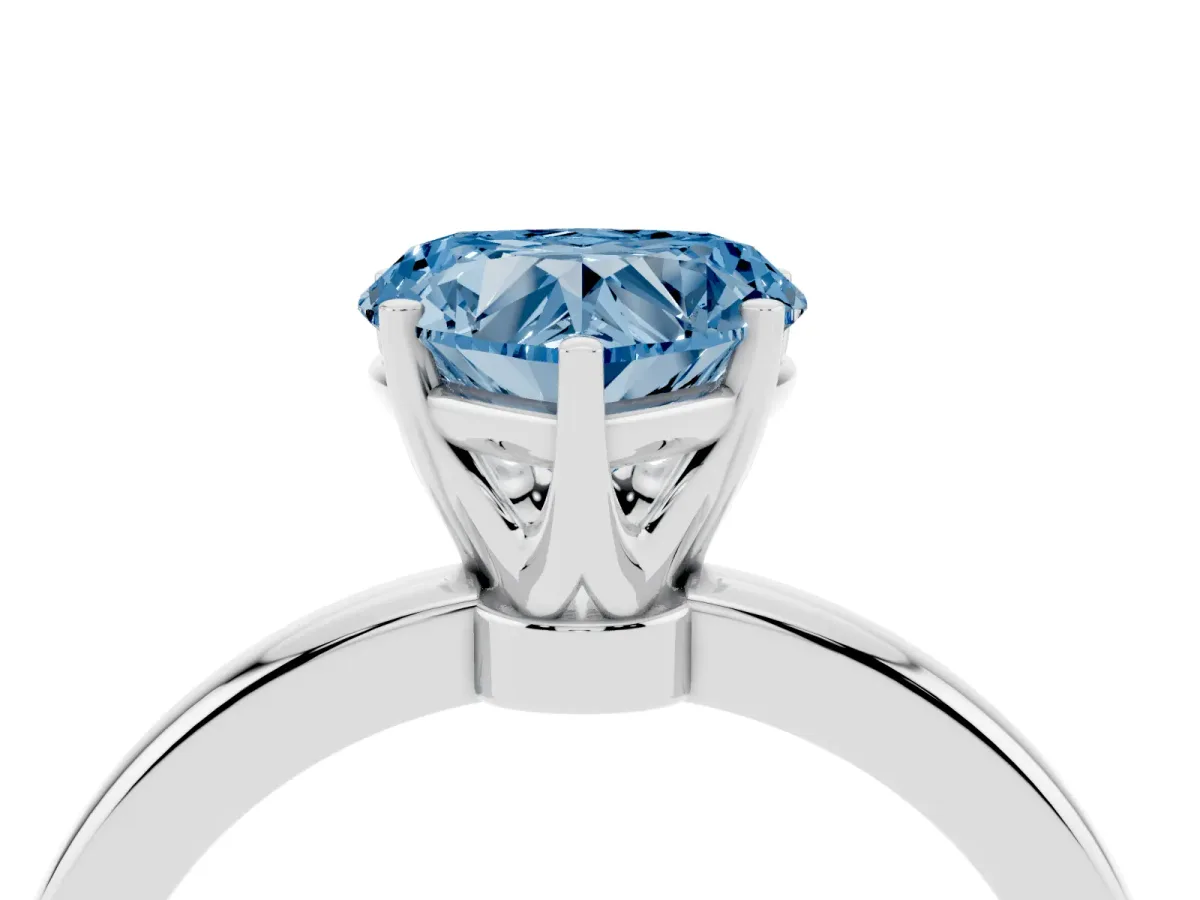 Fancy Blue Heart Cut Solitaire Diamond Ring with Six-Prong Setting on a Classic Band Platinum