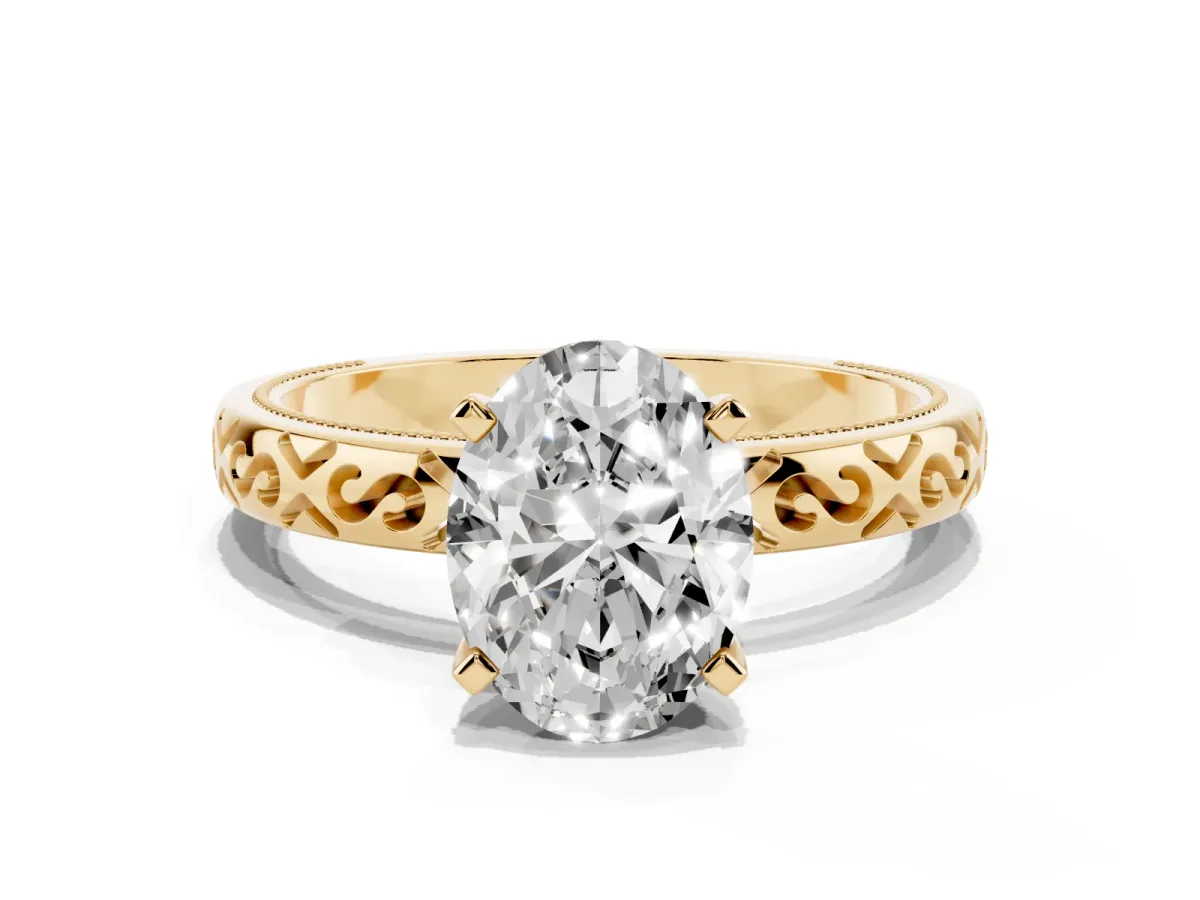 Oval Cut Solitaire Engagement Ring with Scrollwork Band and Four-Prong Setting Yellow gold