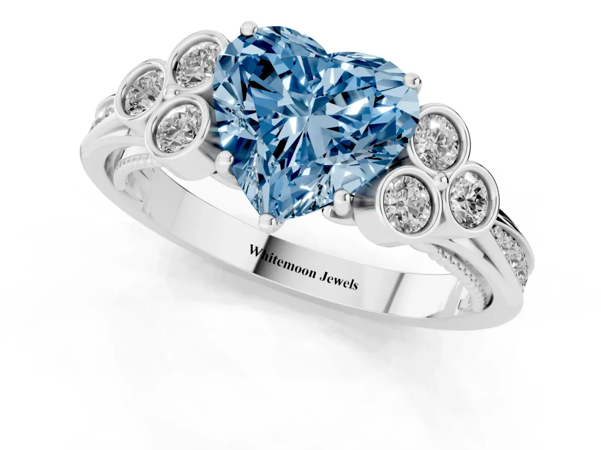 Fancy Blue Heart Cut Cut Diamond Engagement Ring with Bezel Set Round Side Stones and Prong Setting Silver