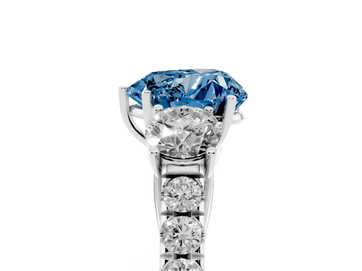 Fancy Blue Heart Cut Cut Diamond Three-Stone Ring with Round Side Stones and Pavé Band Platinum