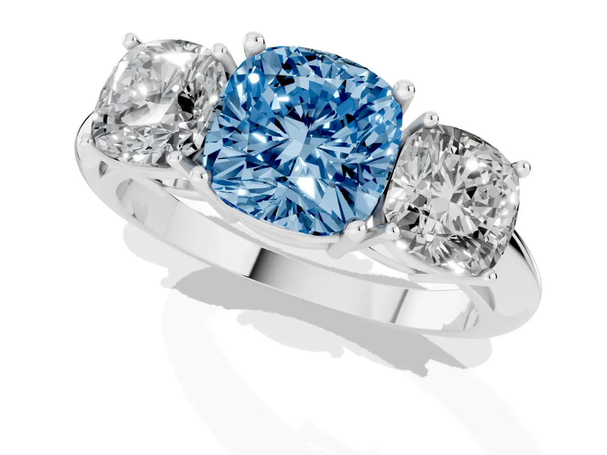 Fancy Blue Three-Stone Cushion Cut Cut Diamond Engagement Ring with Prong Setting on a White Gold Band Platinum