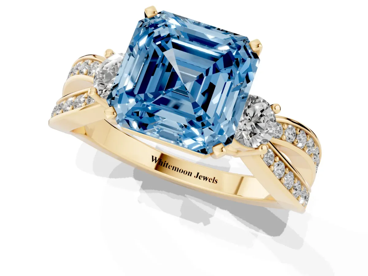 Fancy Blue Three-Stone Asscher Cut Cut Diamond Twist Band with Prong Setting Yellow gold