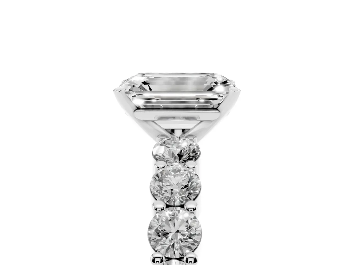 Emerald Cut Diamond Solitaire Ring with Shared Prong Round Side Stones Platinum