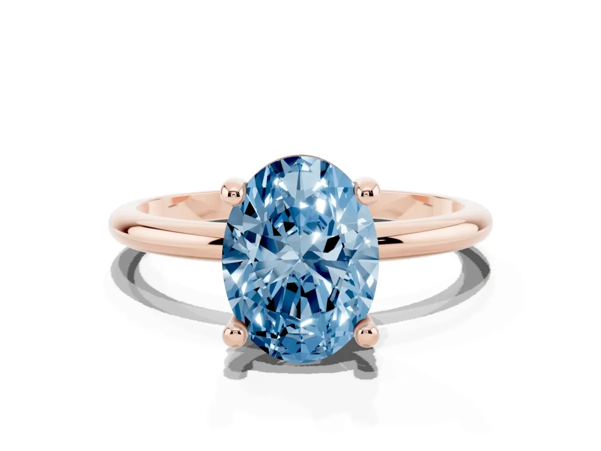 Fancy Blue Oval Cut Solitaire Diamond Ring with 4-Prong Setting on a Classic Band Rose gold
