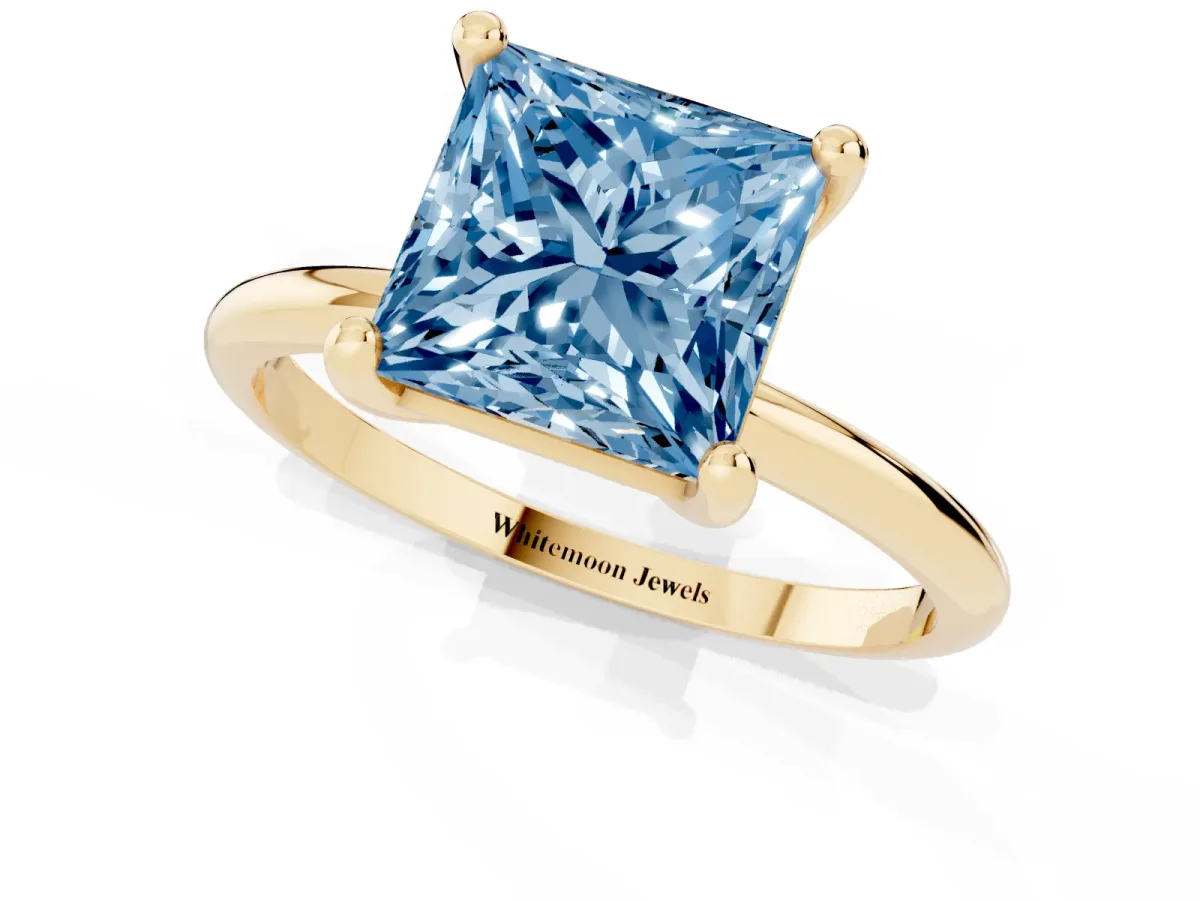 Fancy Blue Princess Cut Solitaire Diamond Ring with 4-Prong Setting on a Classic Band Yellow gold