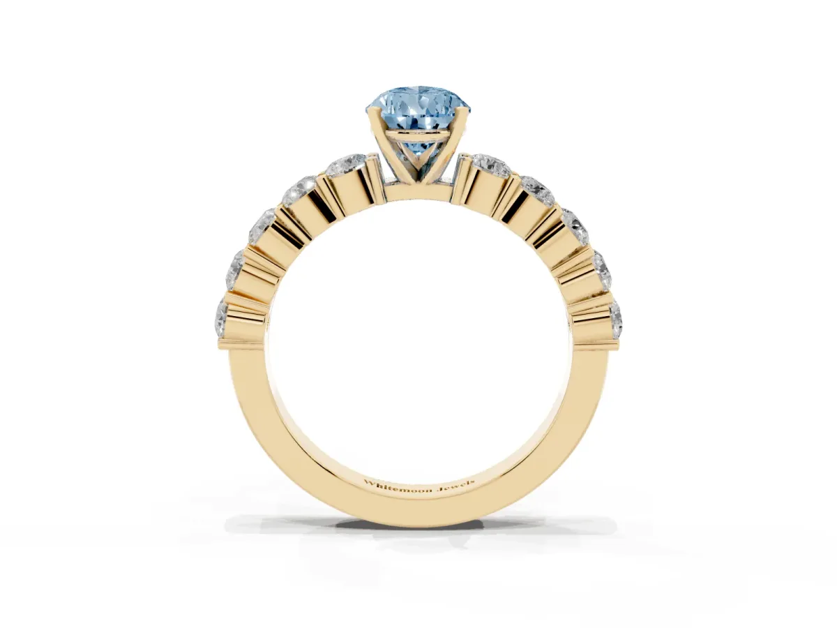 Fancy Blue Pear Cut Diamond Solitaire Ring with Shared Prong Round Side Stones Yellow gold