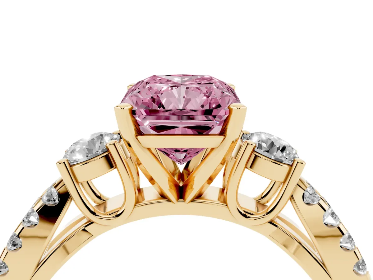 Fancy Pink Radiant Cut Diamond Three-Stone Ring with Pavé Split Shank and Four-Prong Setting Yellow gold