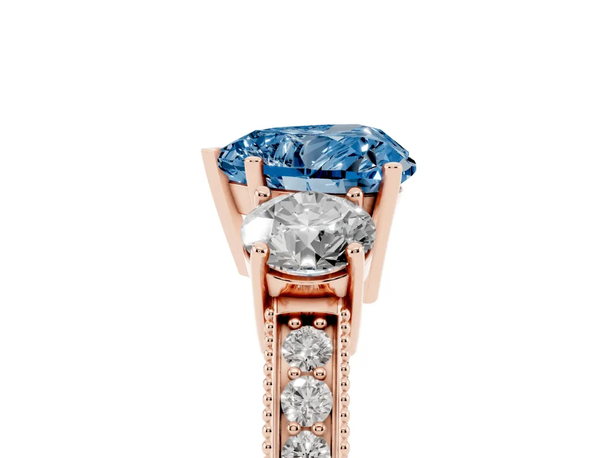 Fancy Blue Heart Cut Three-Stone Diamond Ring with Pavé Band and Four-Prong Setting Rose gold