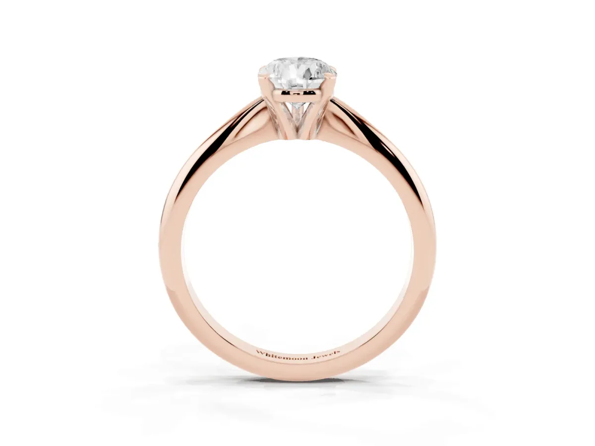 Pear Cut Cut Solitaire Ring with Four-Prong Setting on a Classic Band Rose gold