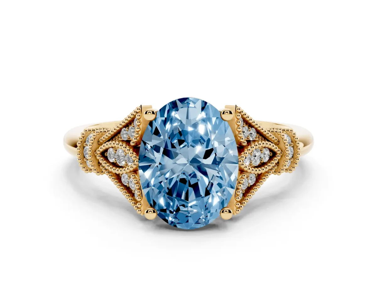 Fancy Blue Oval Cut Diamond Solitaire Ring with Floral Filigree and Pave Accents Yellow gold