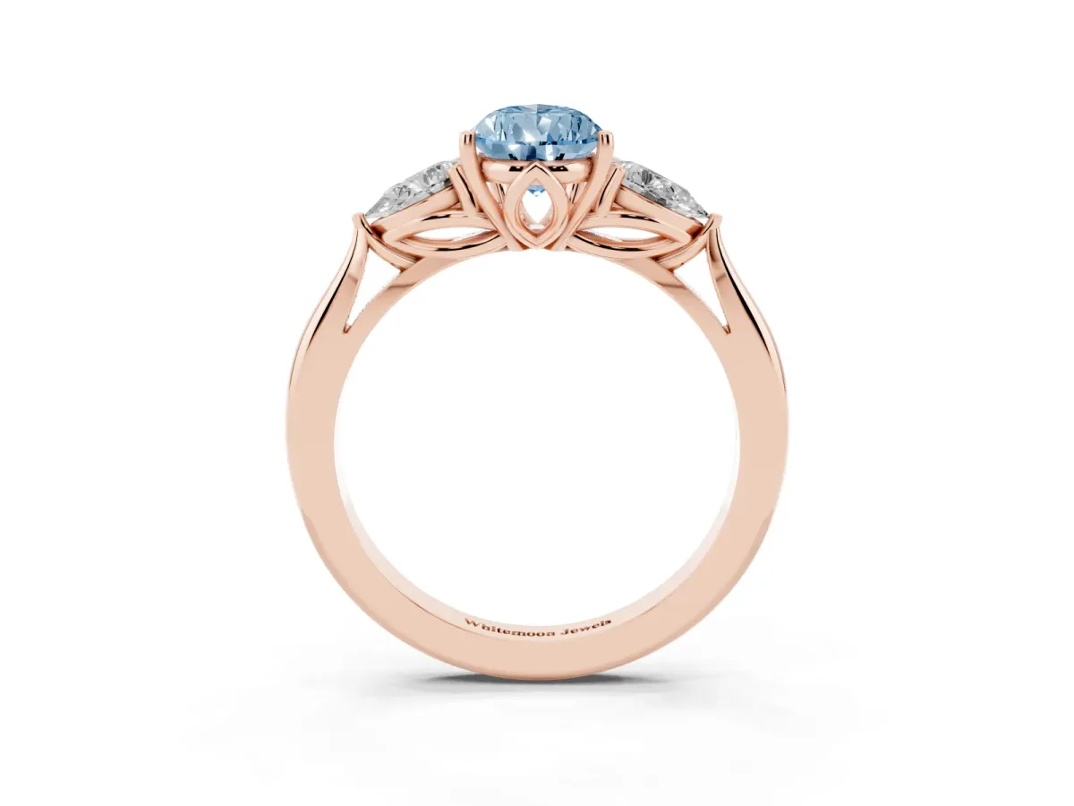 Fancy Blue Three-Stone Pear Cut Diamond Ring with Pear Side Stones in Four-Prong Setting Rose gold